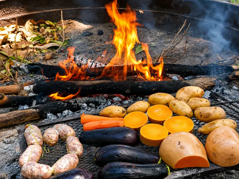 Traditional Argentine barbecue with meat and vegetables prepared for a countryside day at El Carmen