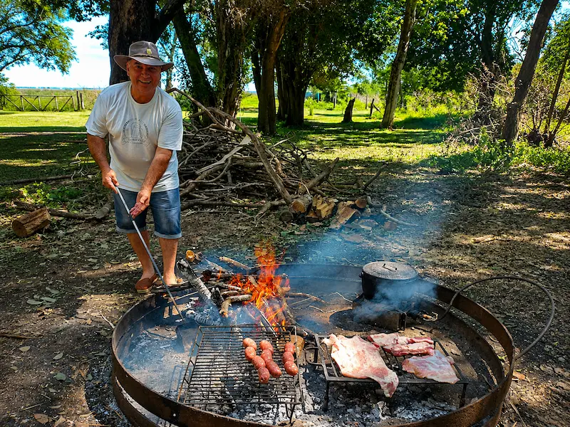 Barbecue by the fire pit during an outdoor countryside gathering