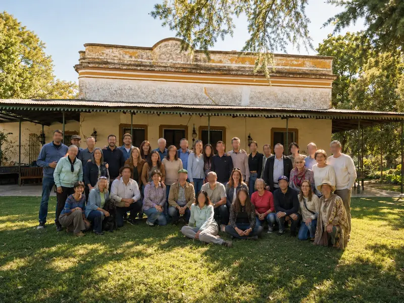 Group gathered in front of the historic house at El Carmen de Rojas
